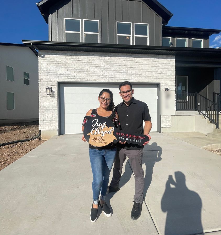 Clients celebrating a closing with Hyrum